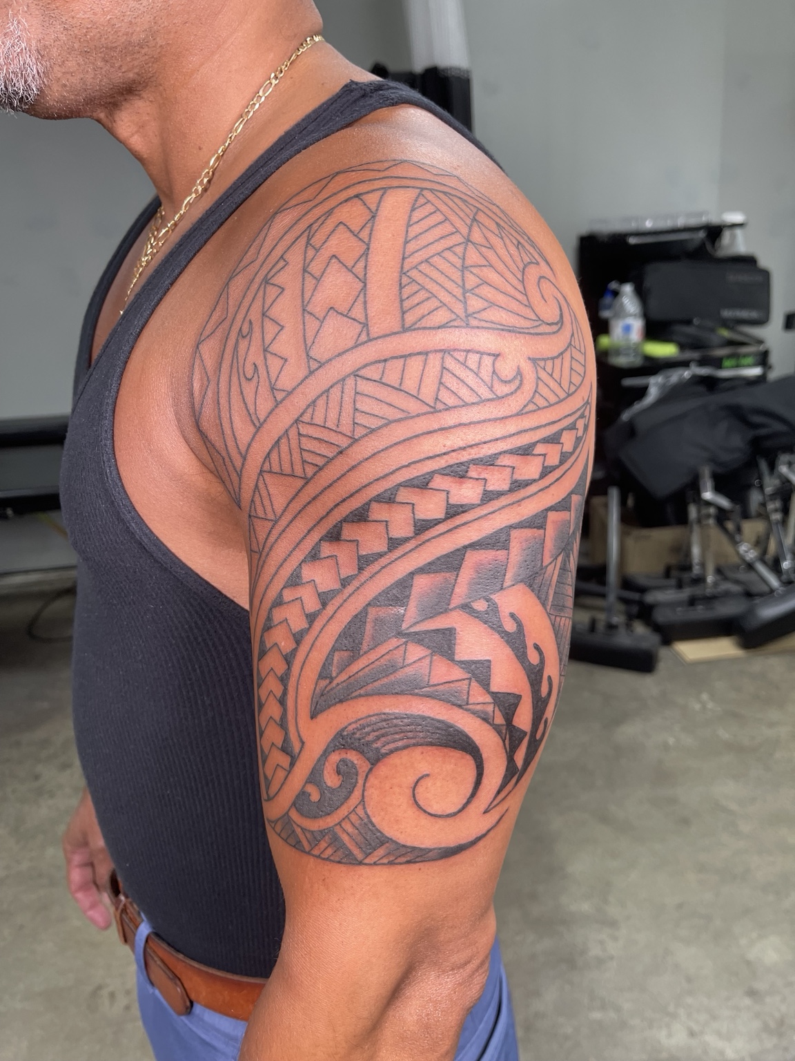 Large Polynesian-style shoulder tattoo