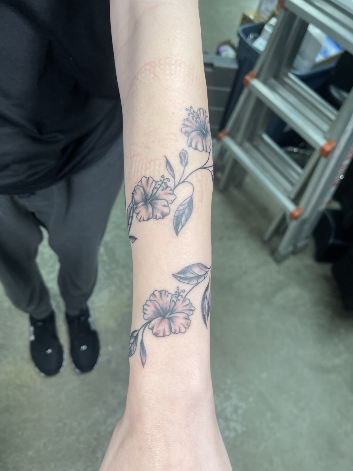 Floral forearm tattoo, primary view
