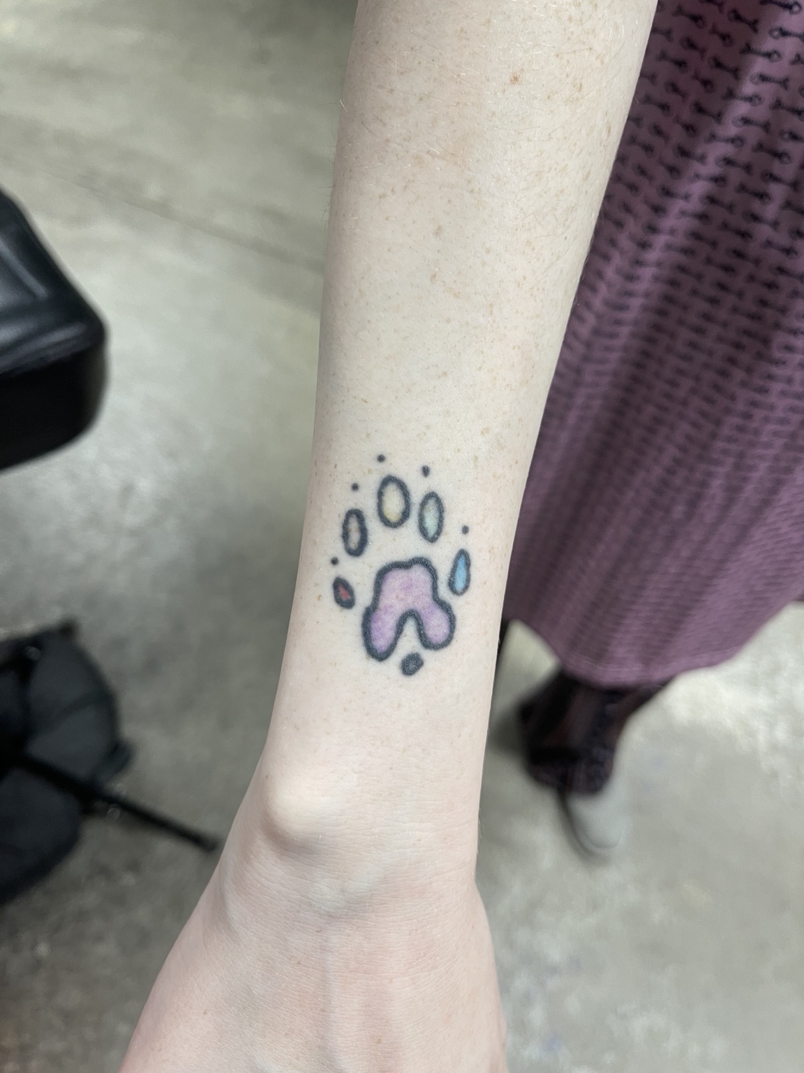 Small paw tattoo