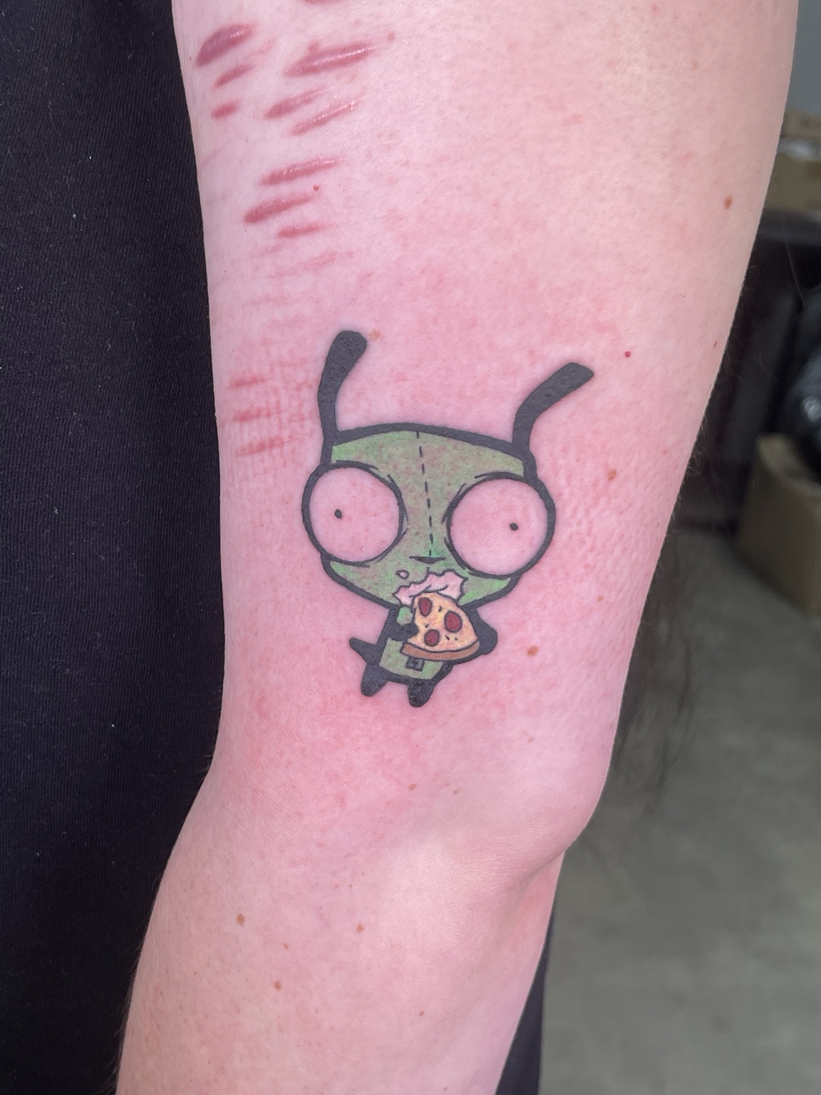 Small cartoon character tattoo