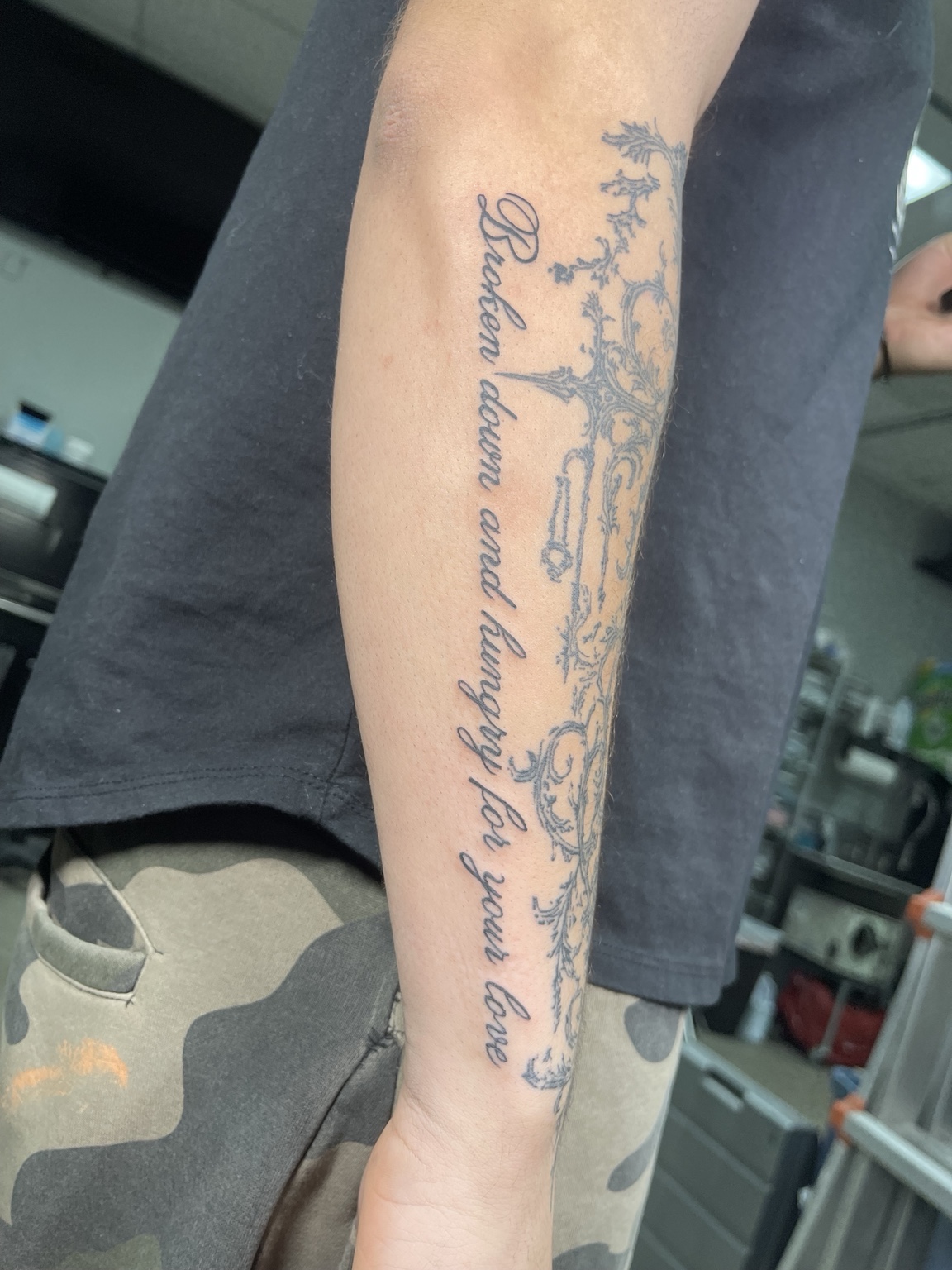 Long script tattoo on forearm
