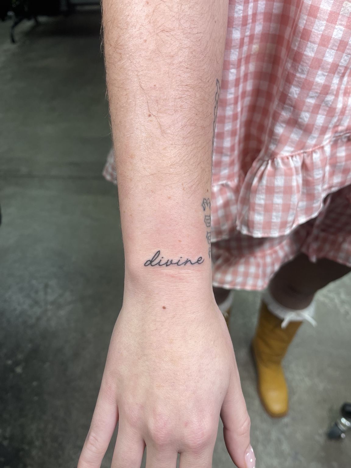 Small script tattoo near wrist