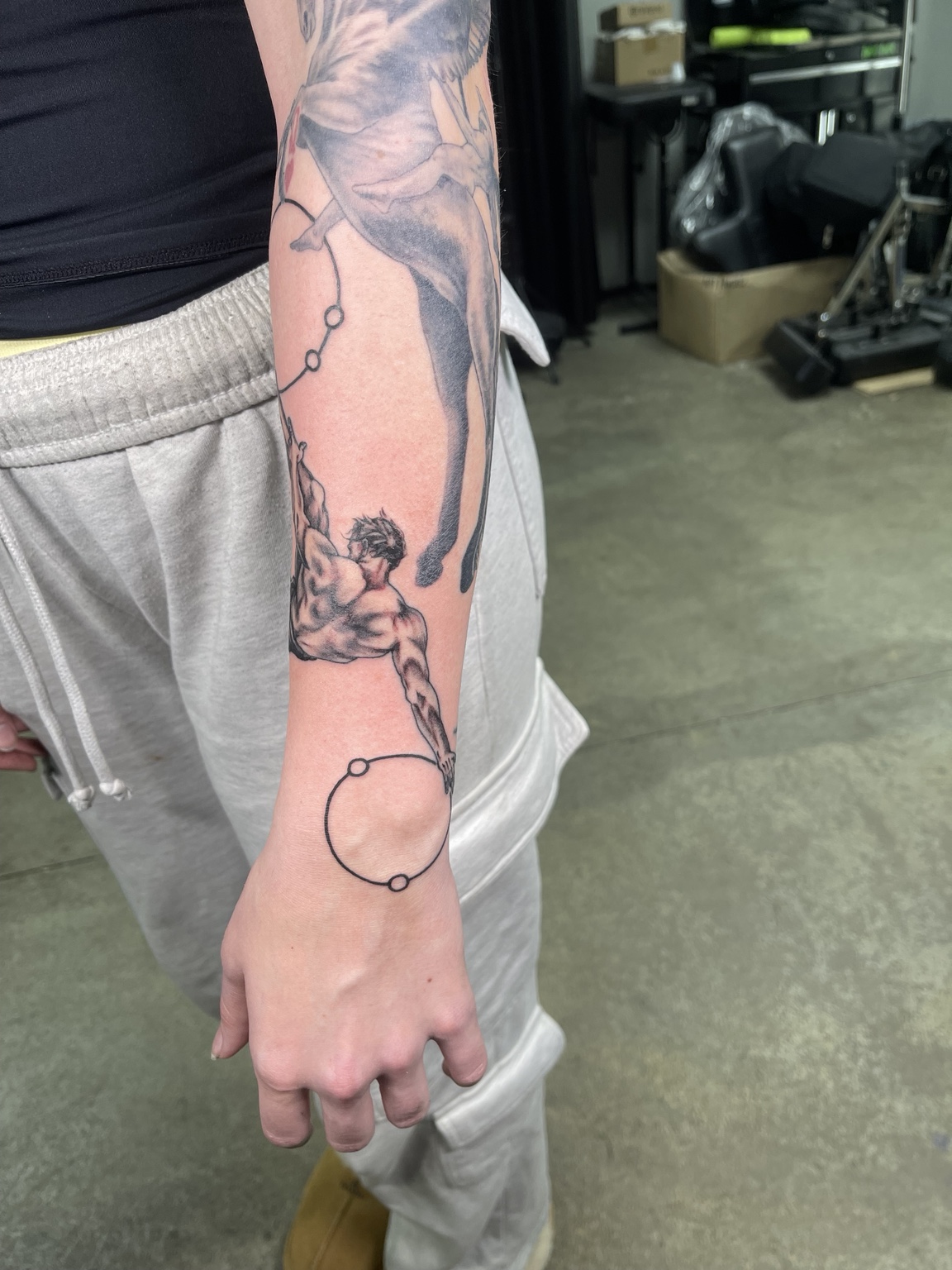 Botanical linework forearm tattoo