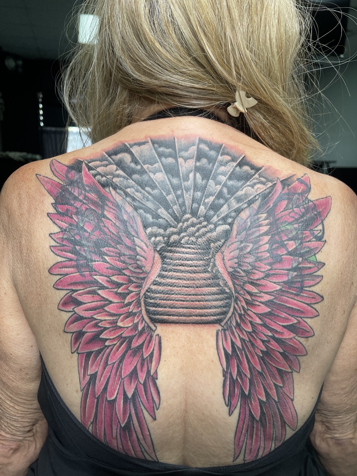Completed winged back tattoo