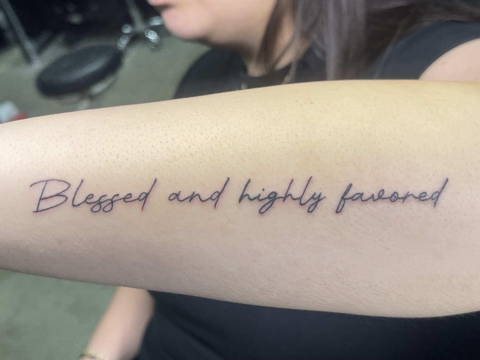 Script tattoo reading blessed and highly favored