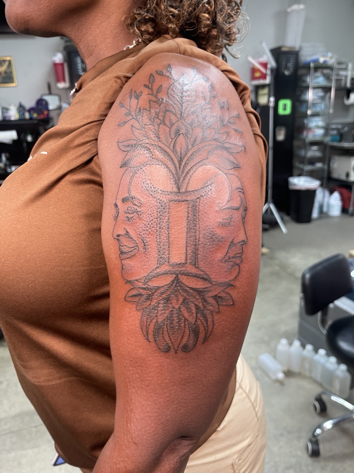 Gemini floral shoulder tattoo