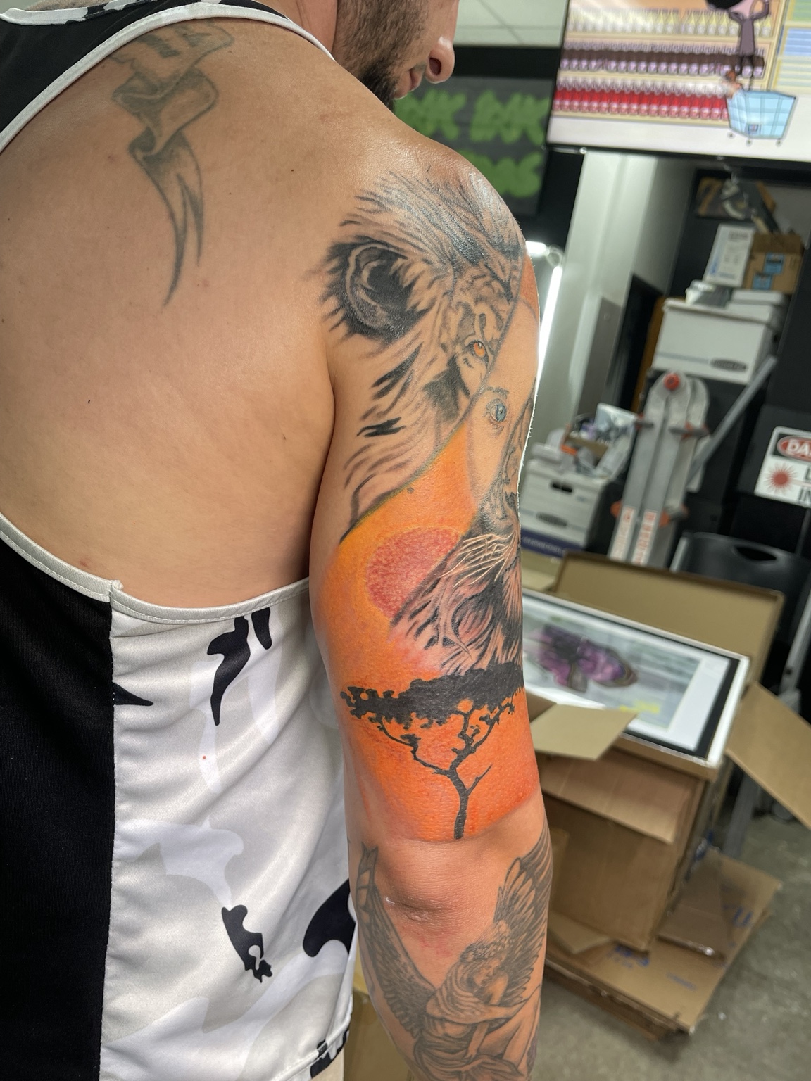 Lion upper arm tattoo alternate view