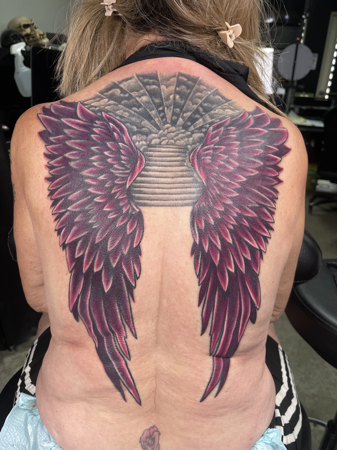 Large winged back tattoo first view