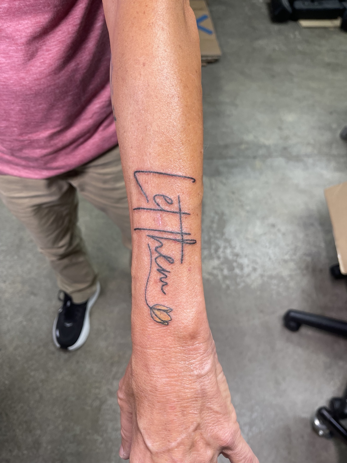 Small forearm script tattoo