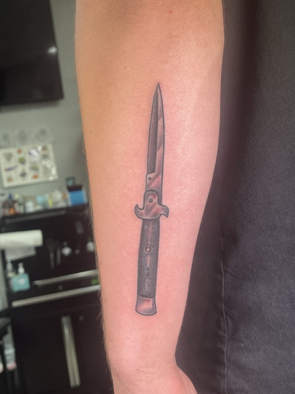 Knife forearm tattoo