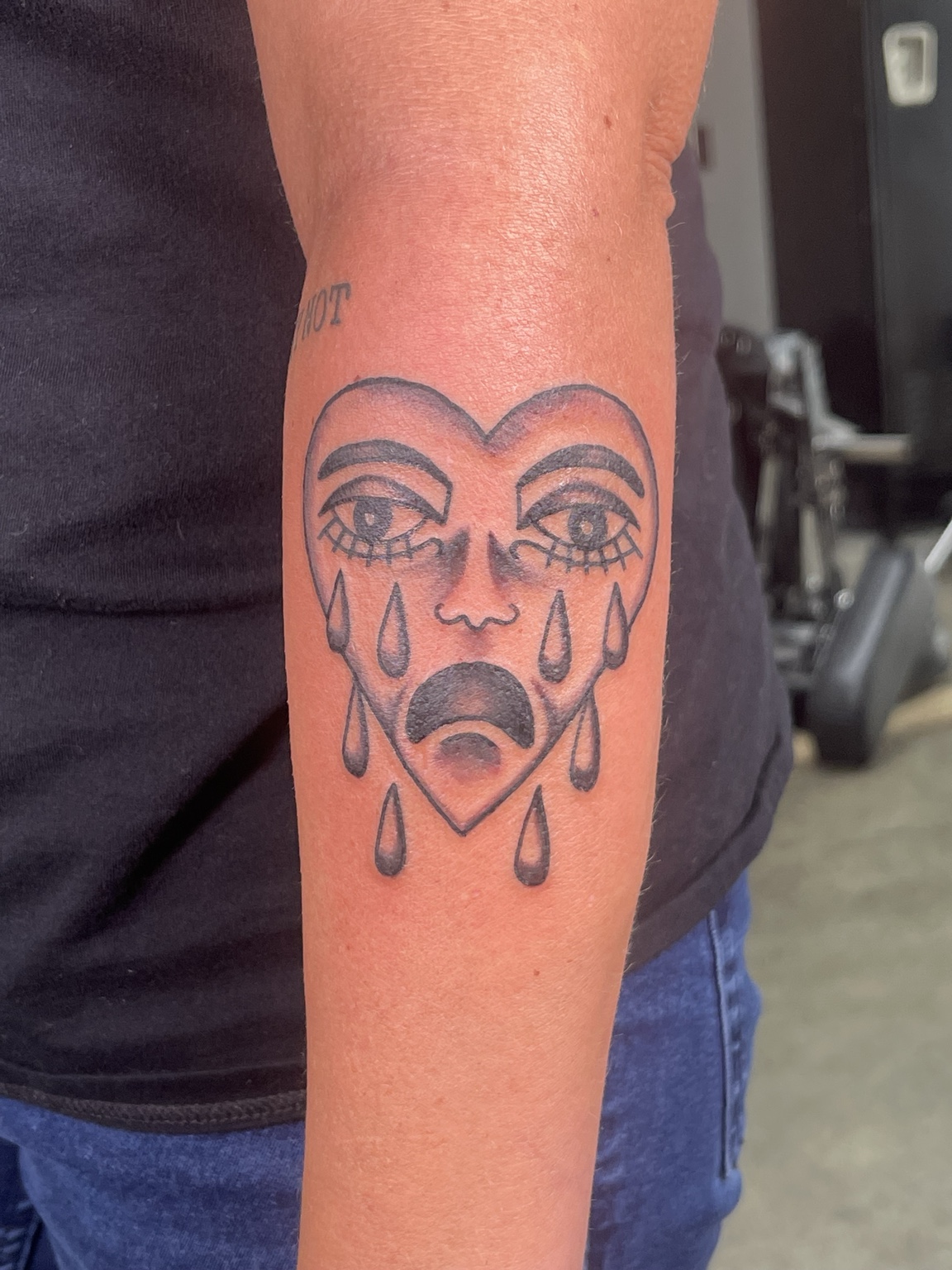 Melting face tattoo