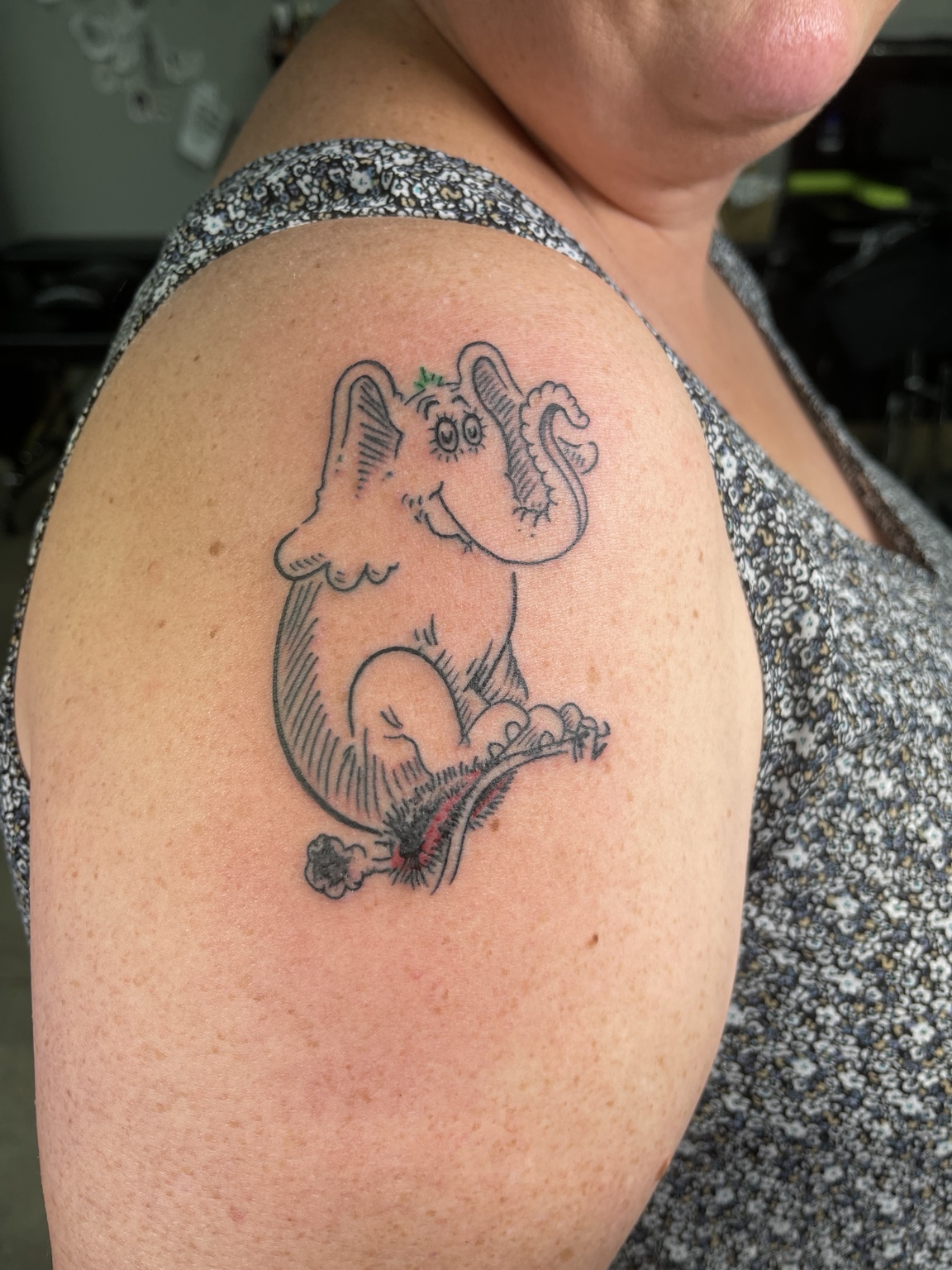 Small animal shoulder tattoo