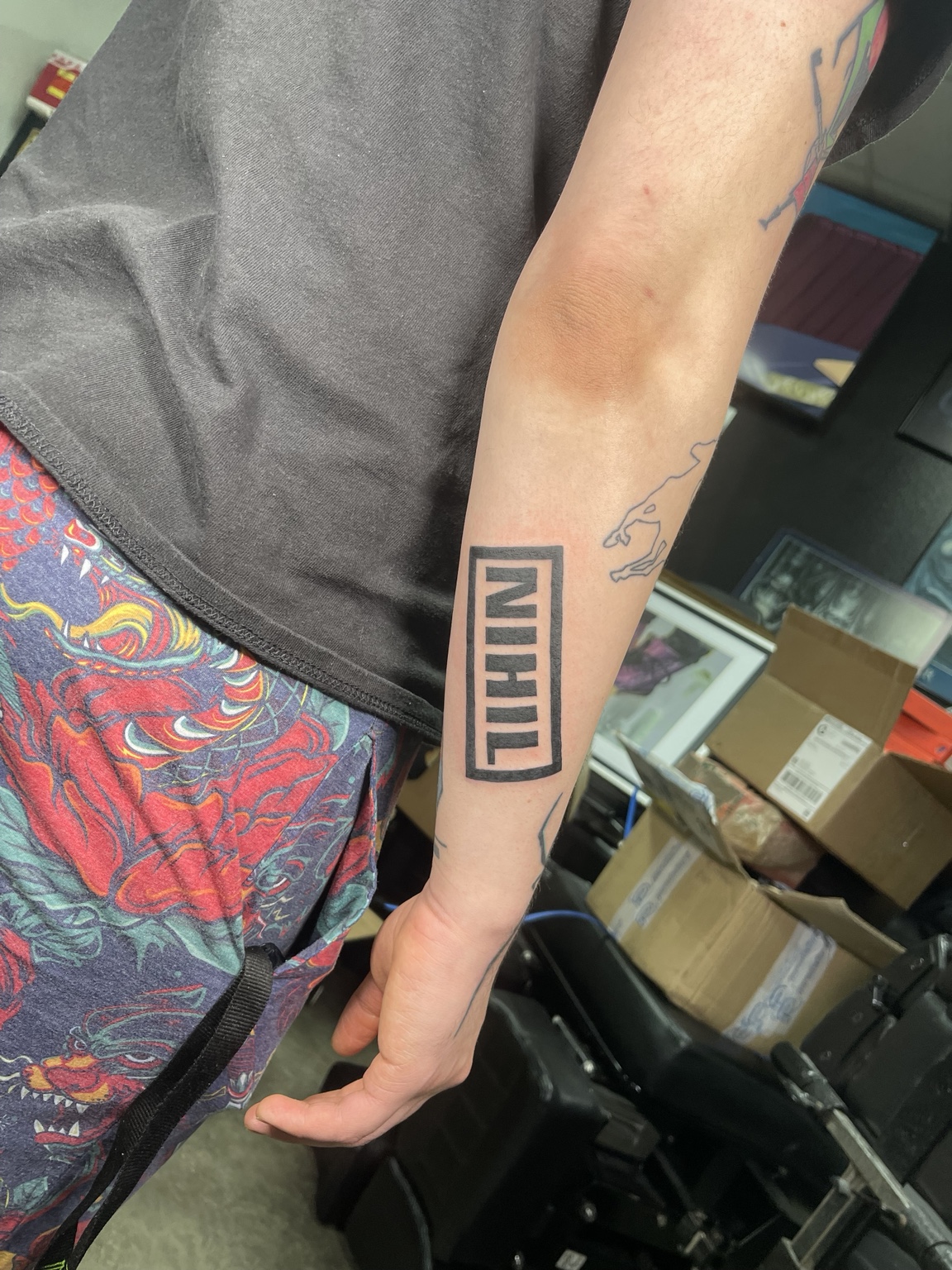 Small forearm lettering tattoo