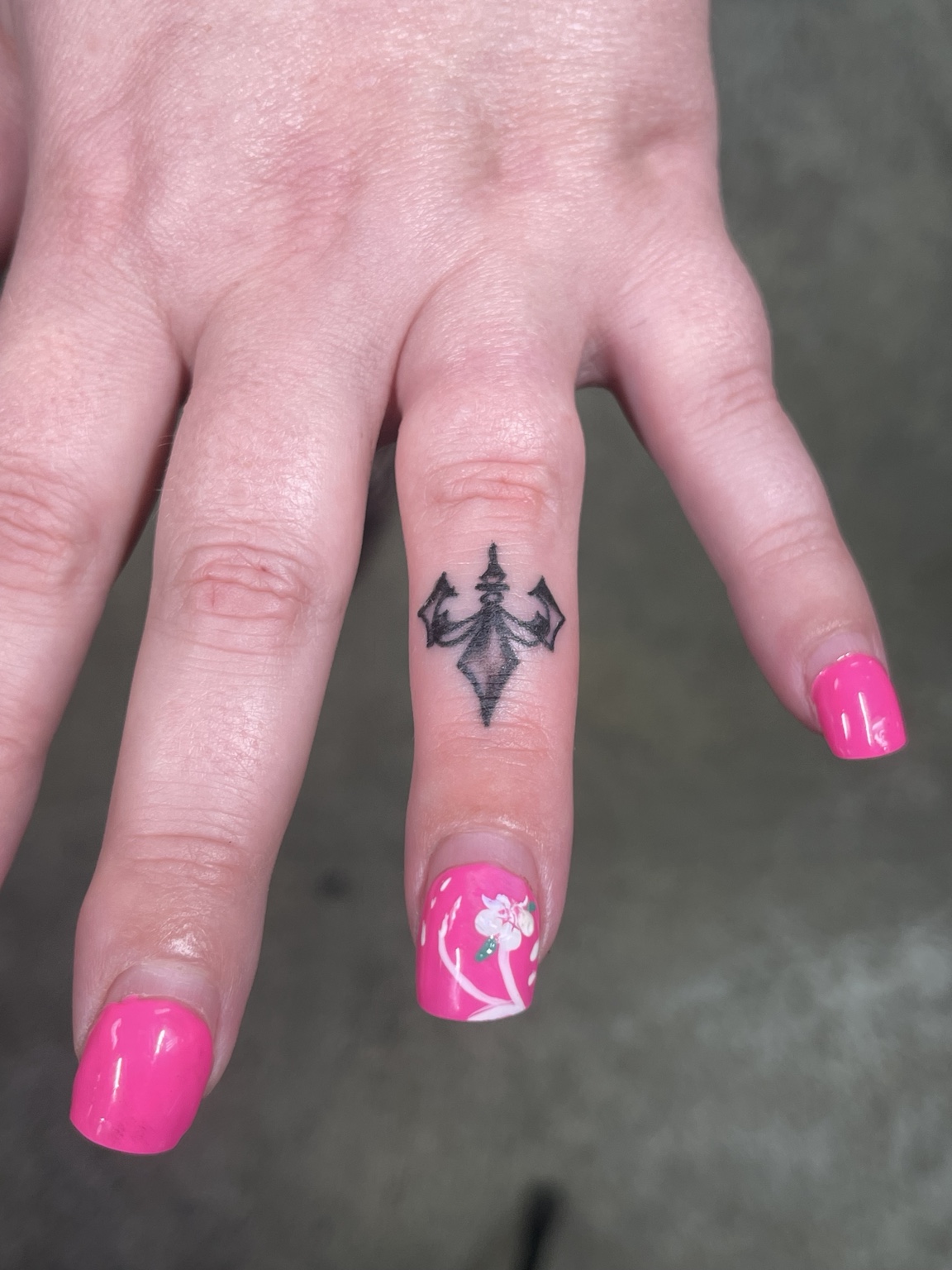 Tiny finger insect tattoo