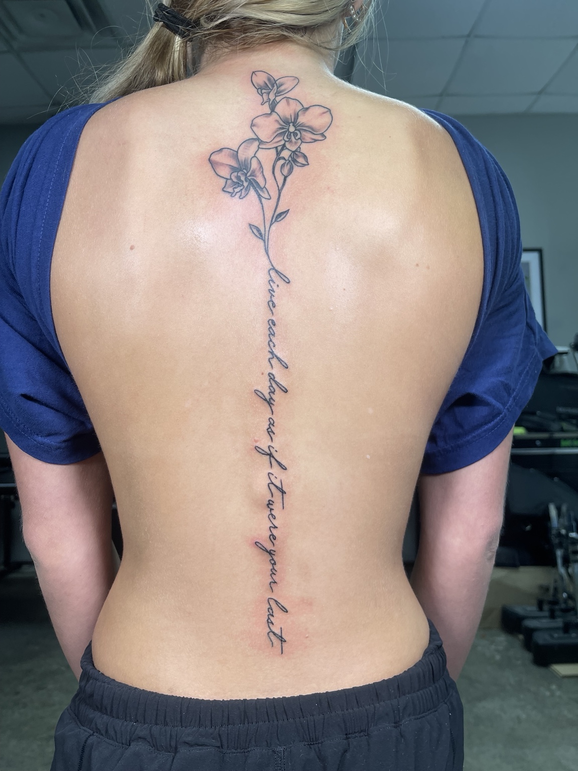 Floral spine tattoo full body view