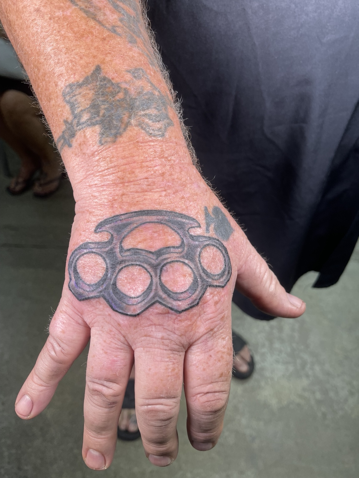 Knuckle and hand tattoo