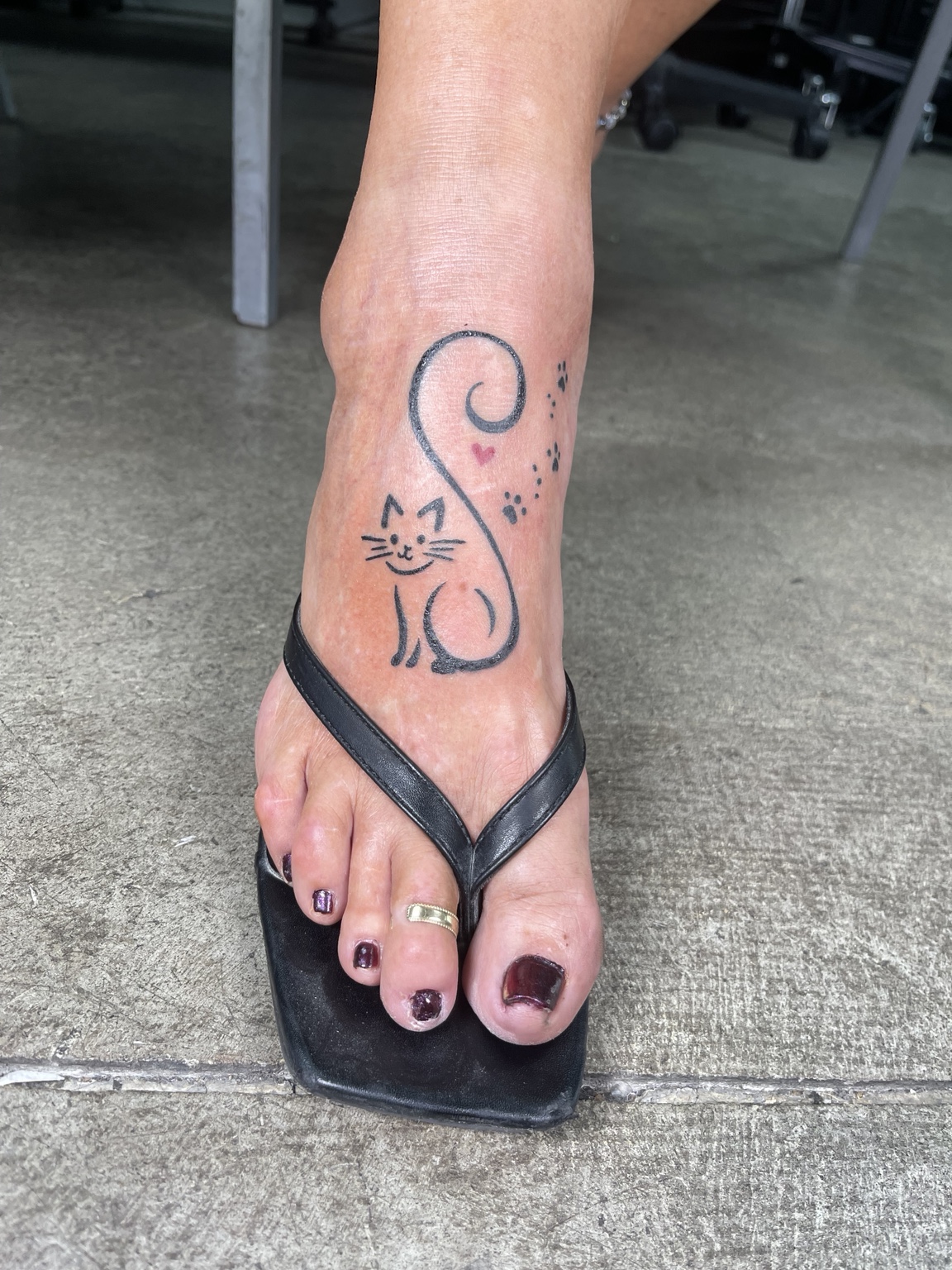 Cat linework foot tattoo