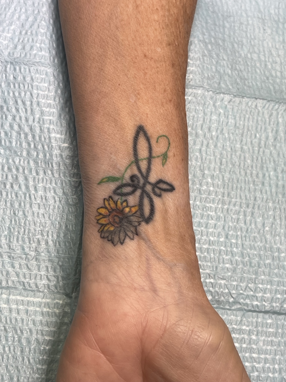 Small wrist tattoo second view