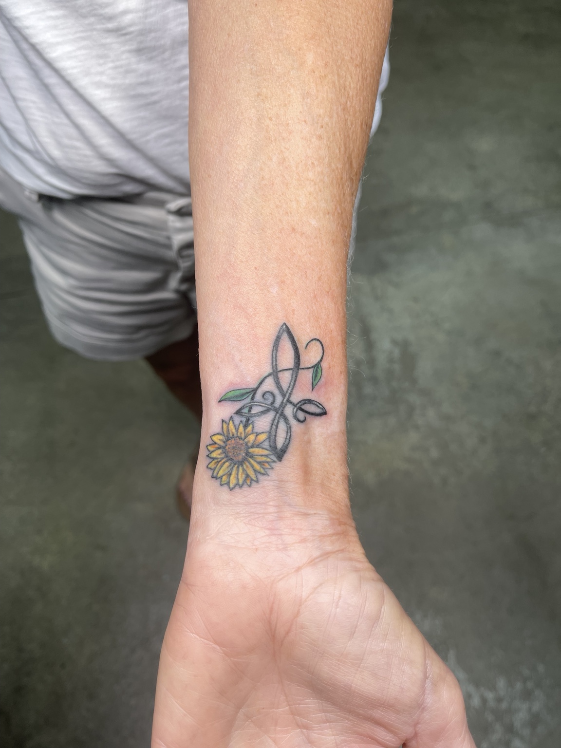 Small wrist tattoo third view