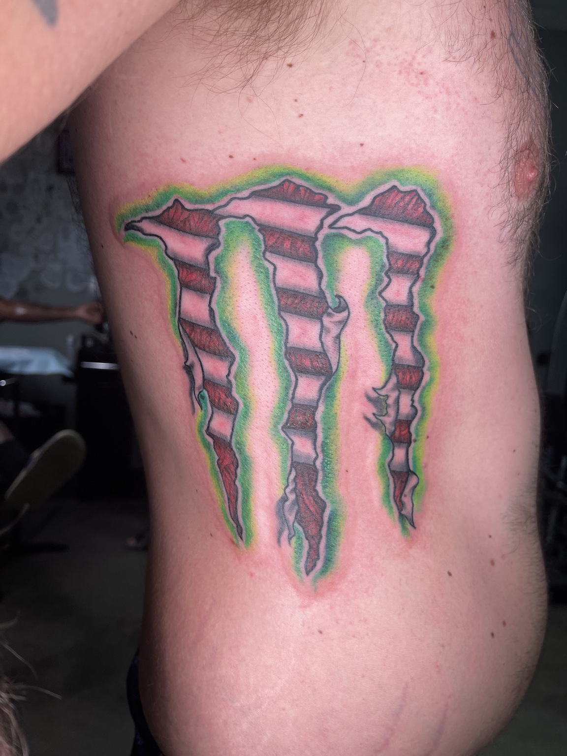 Monster-style logo tattoo