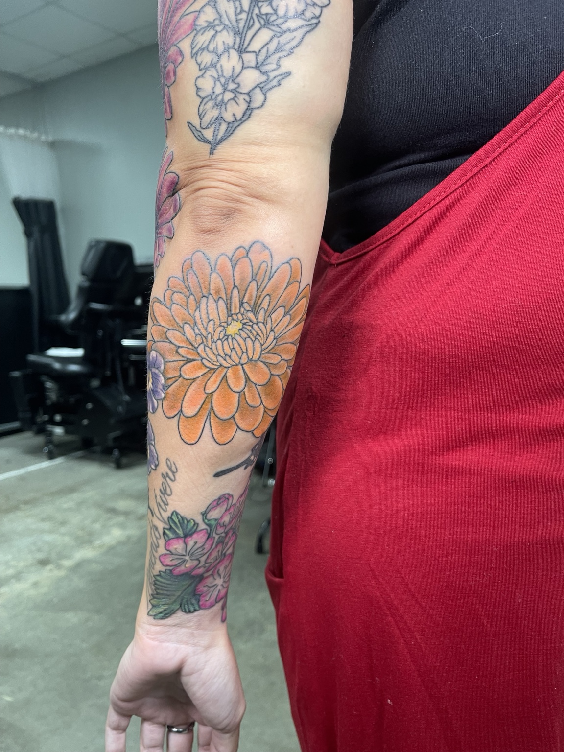 Floral arm and sleeve tattoo