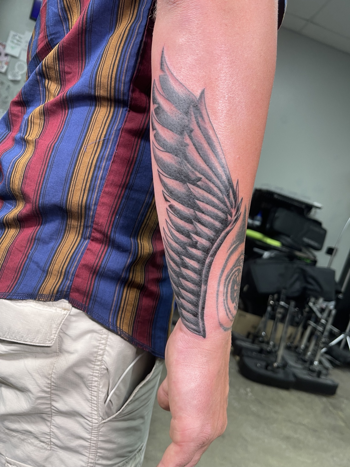 Wing forearm tattoo first view