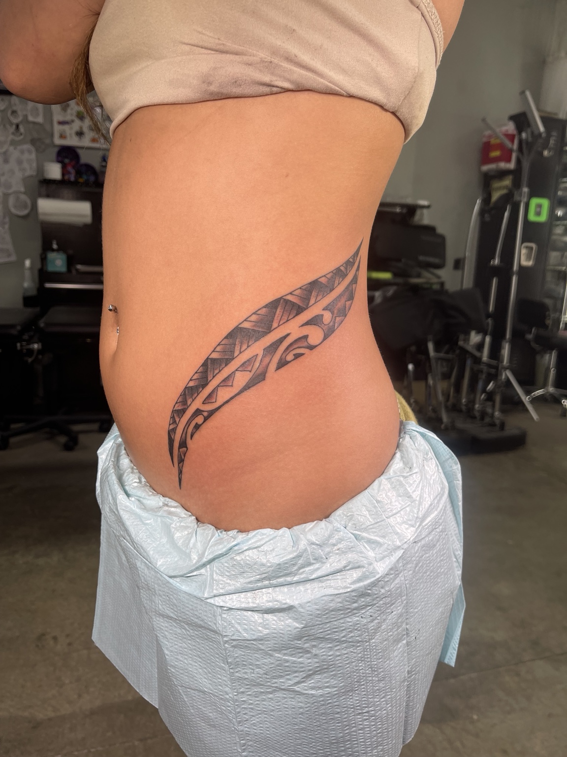 Tribal side tattoo