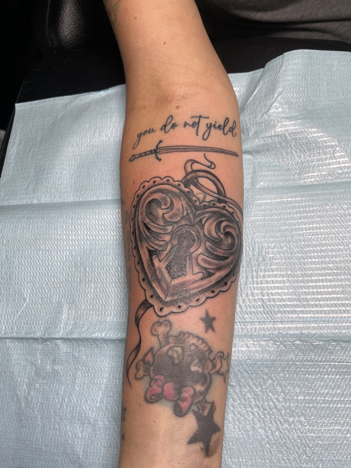 Heart forearm tattoo primary view