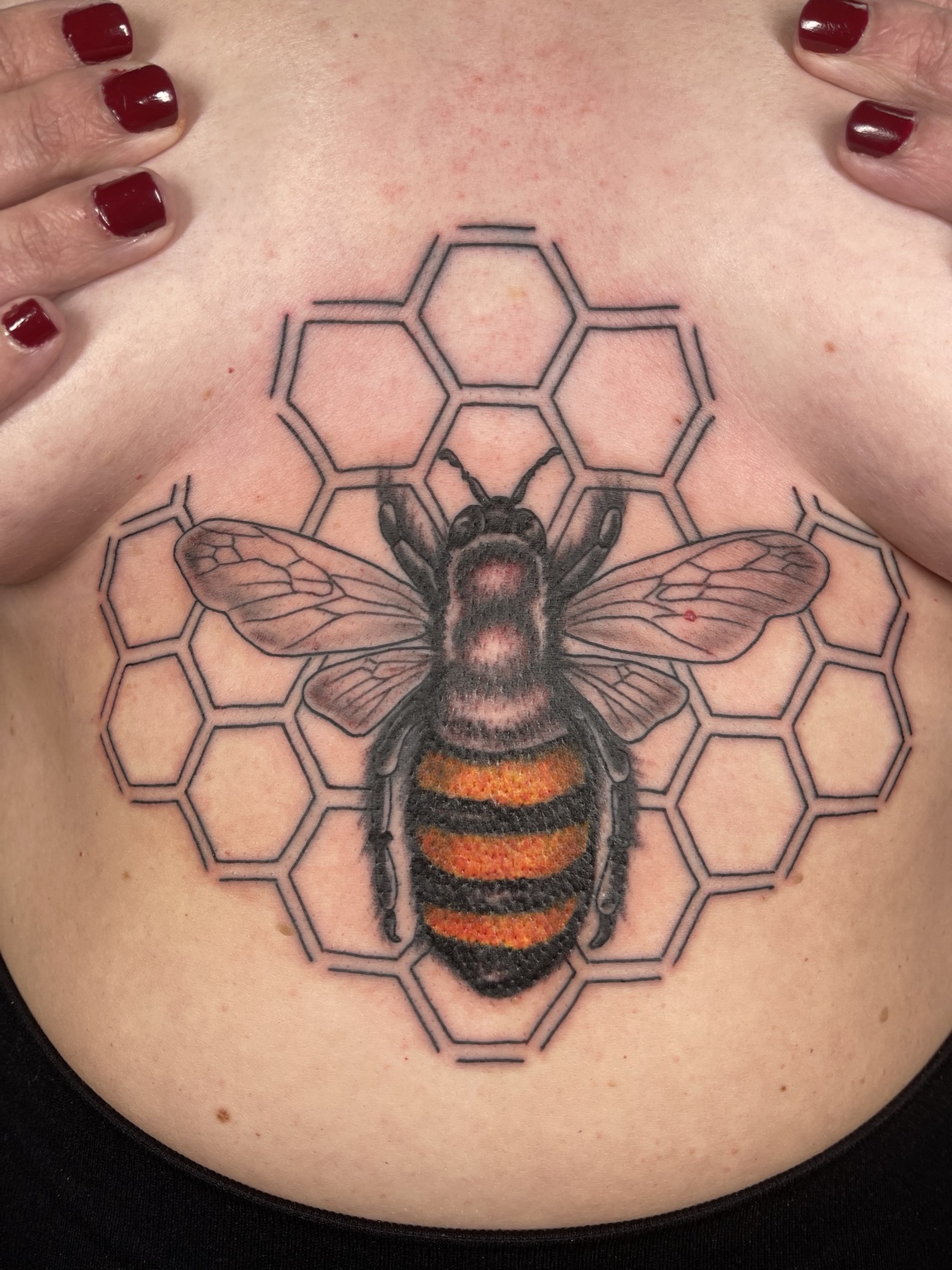 Bee and honeycomb chest tattoo second view