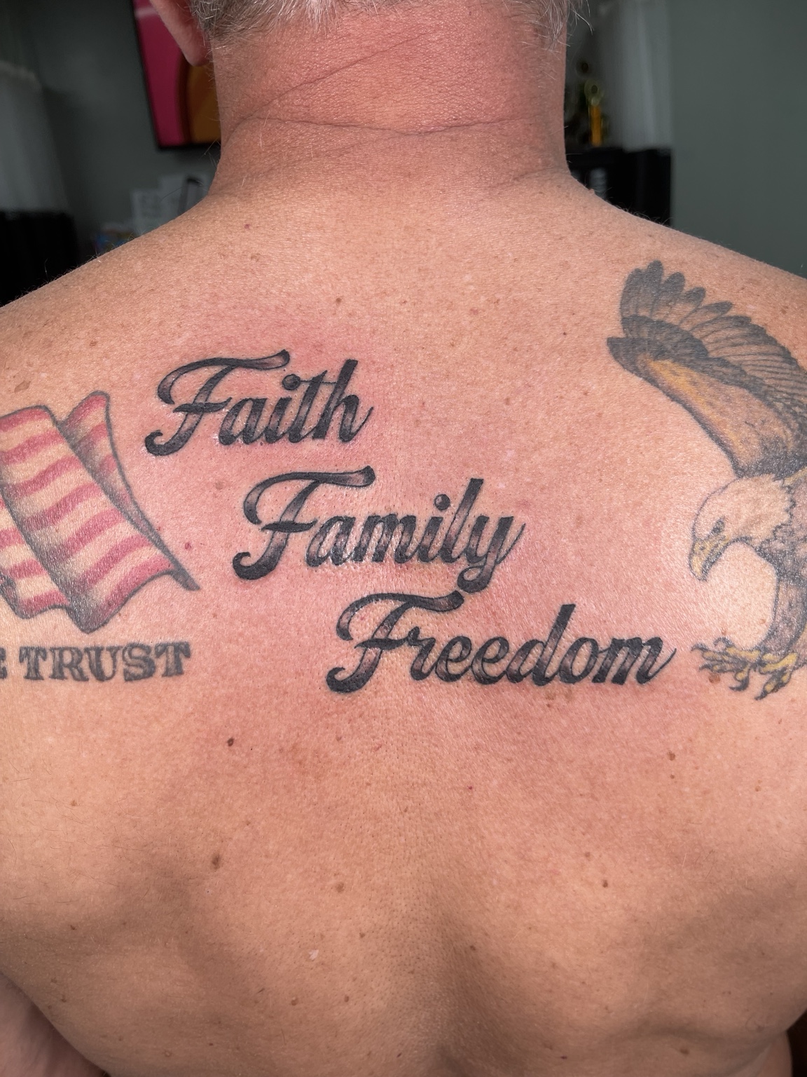 Large back script tattoo