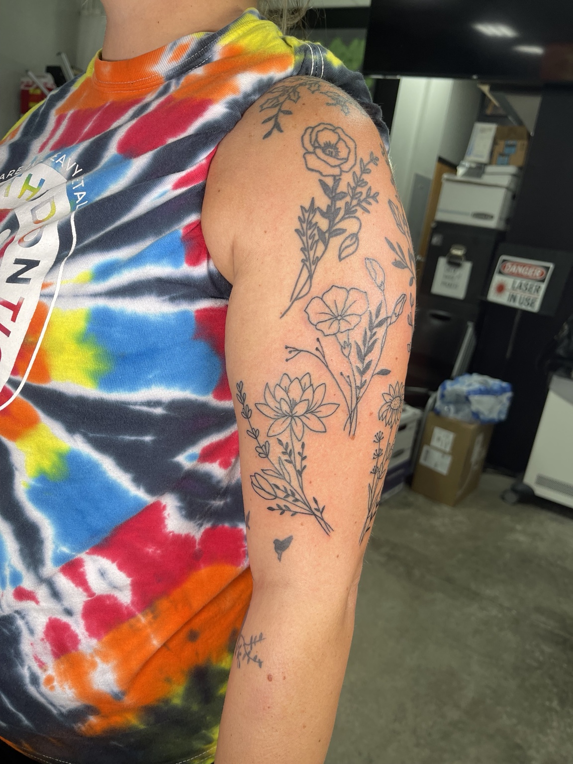 Floral upper arm tattoo alternate view