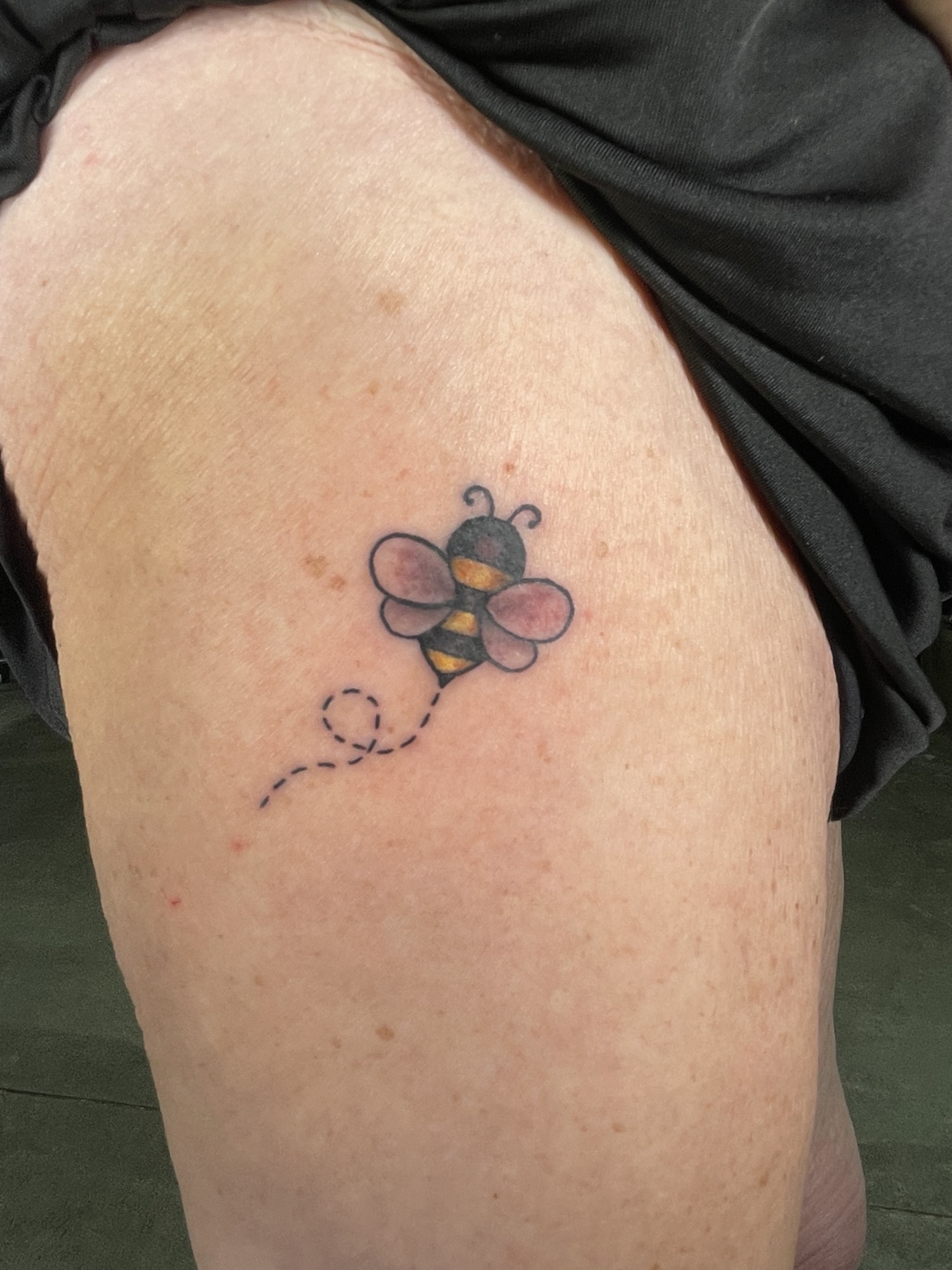 Small colorful flower tattoo