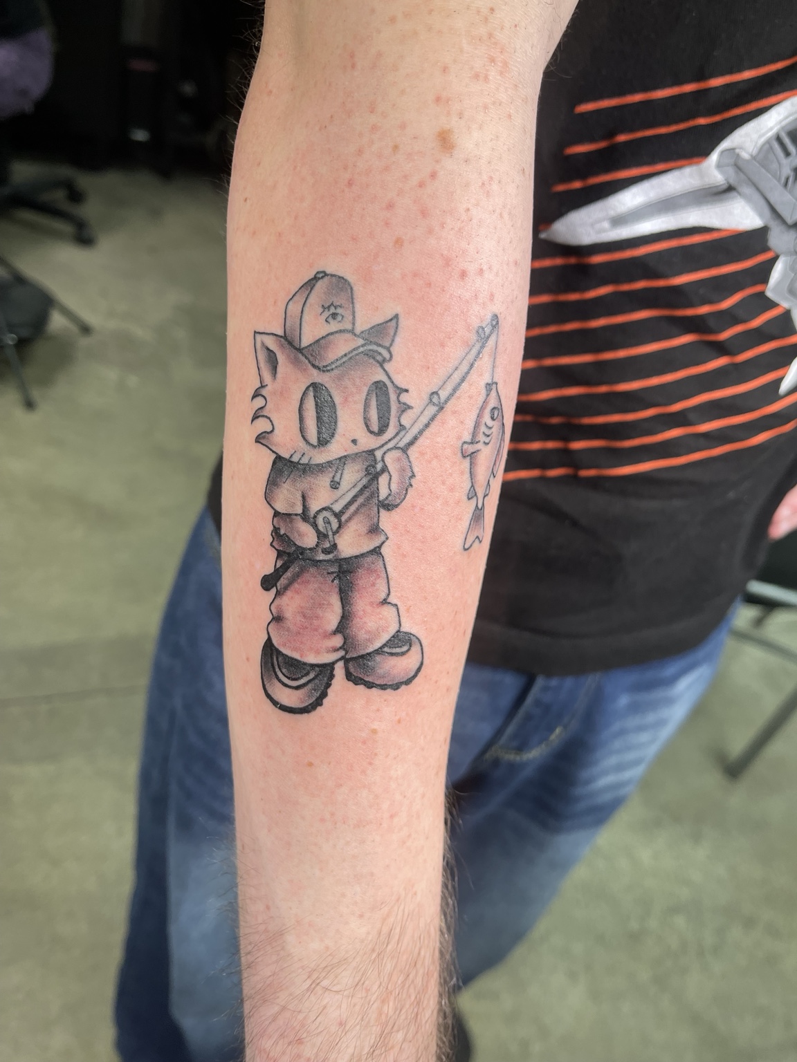 Cartoon forearm tattoo first view