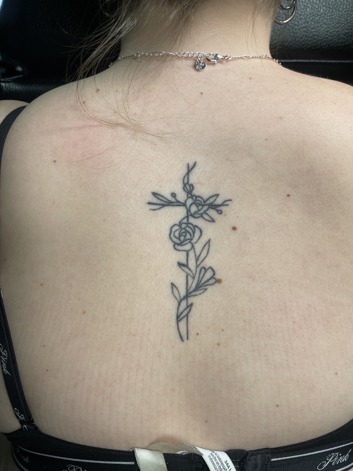 Botanical back tattoo wider view