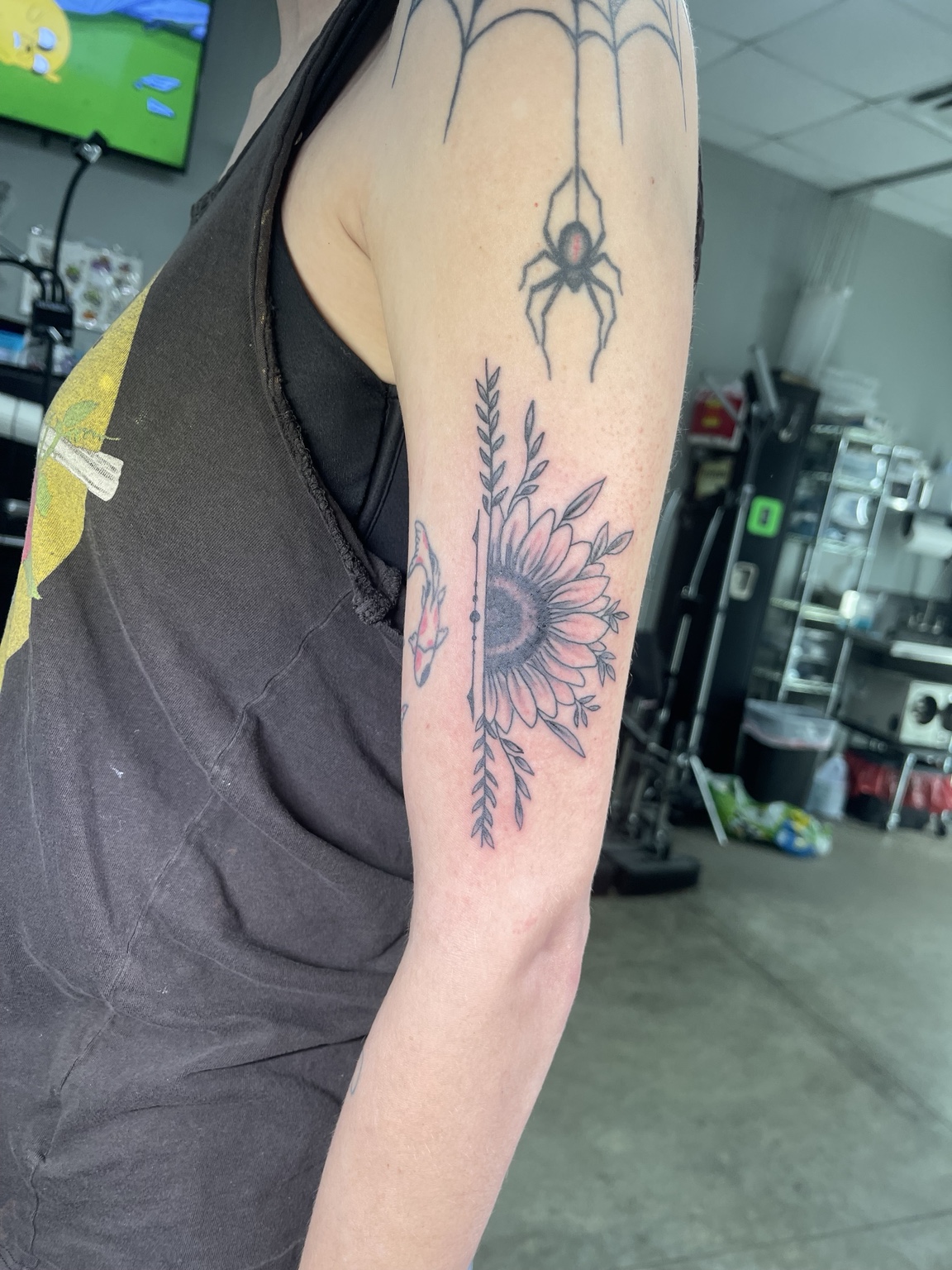Sun upper arm tattoo second view