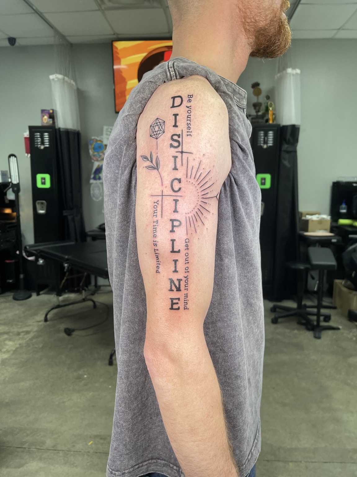 Vertical discipline lettering tattoo alternate view