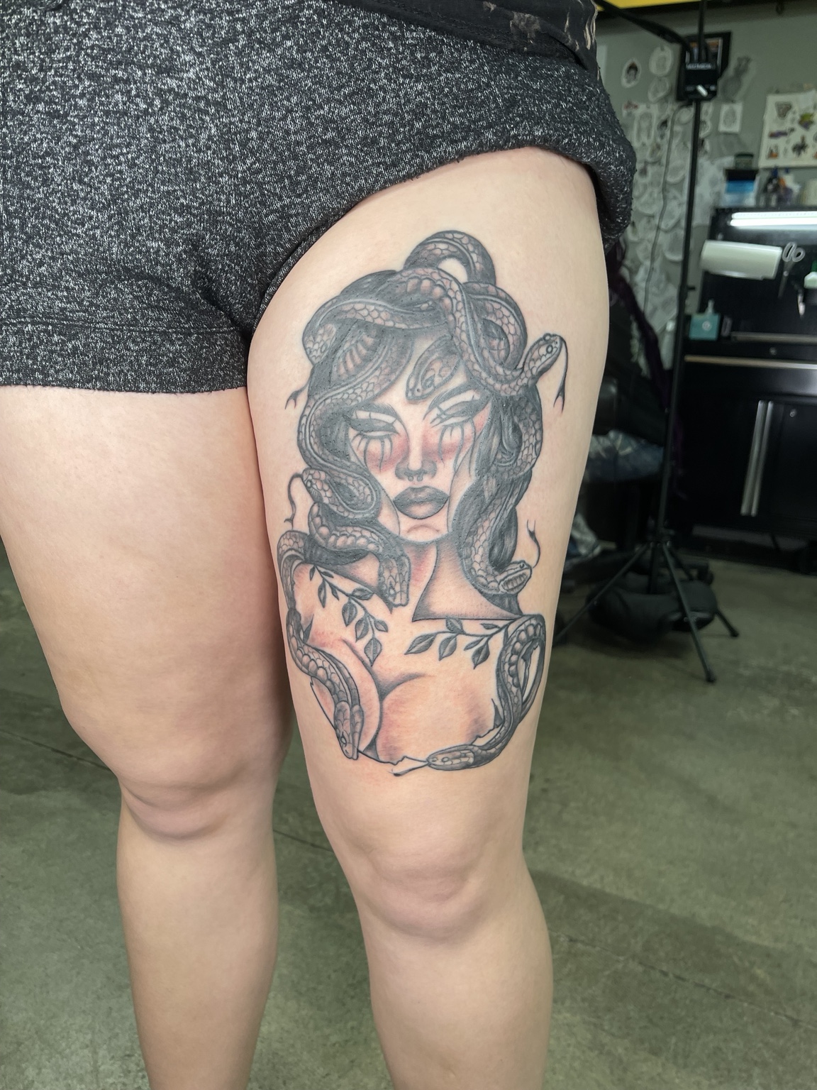 Woman thigh tattoo alternate view