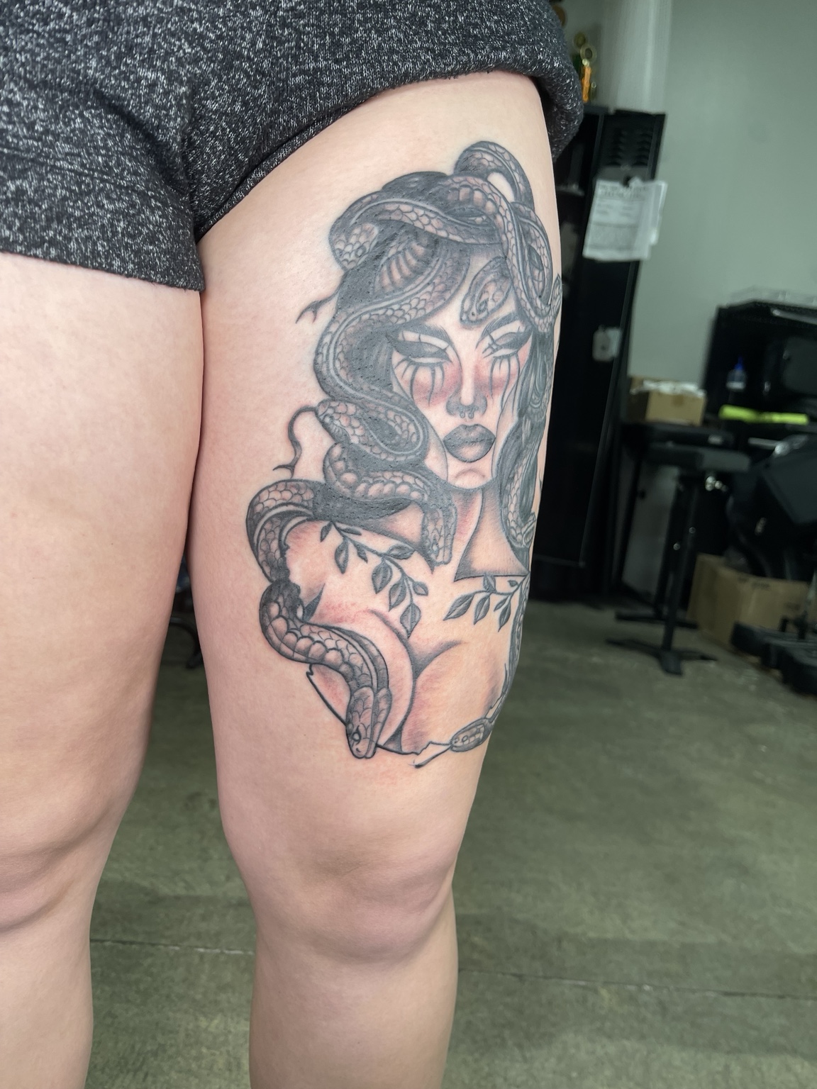 Woman thigh tattoo alternate view