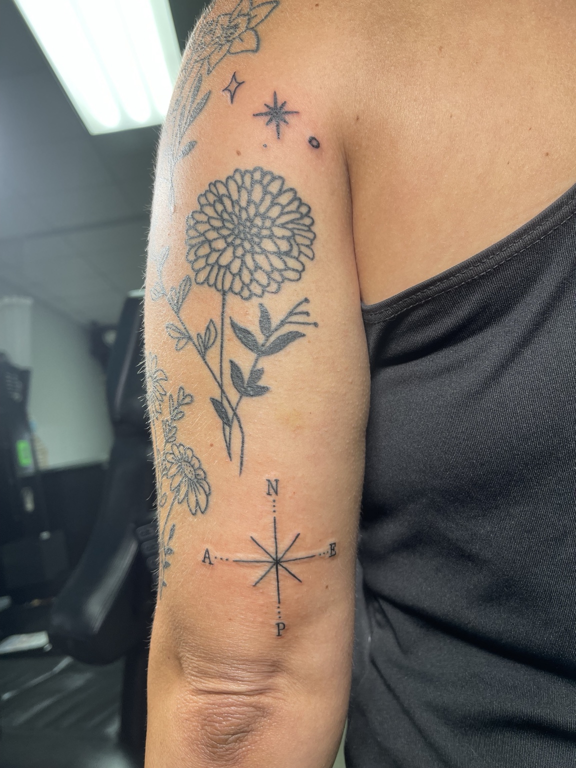 Floral upper arm tattoo