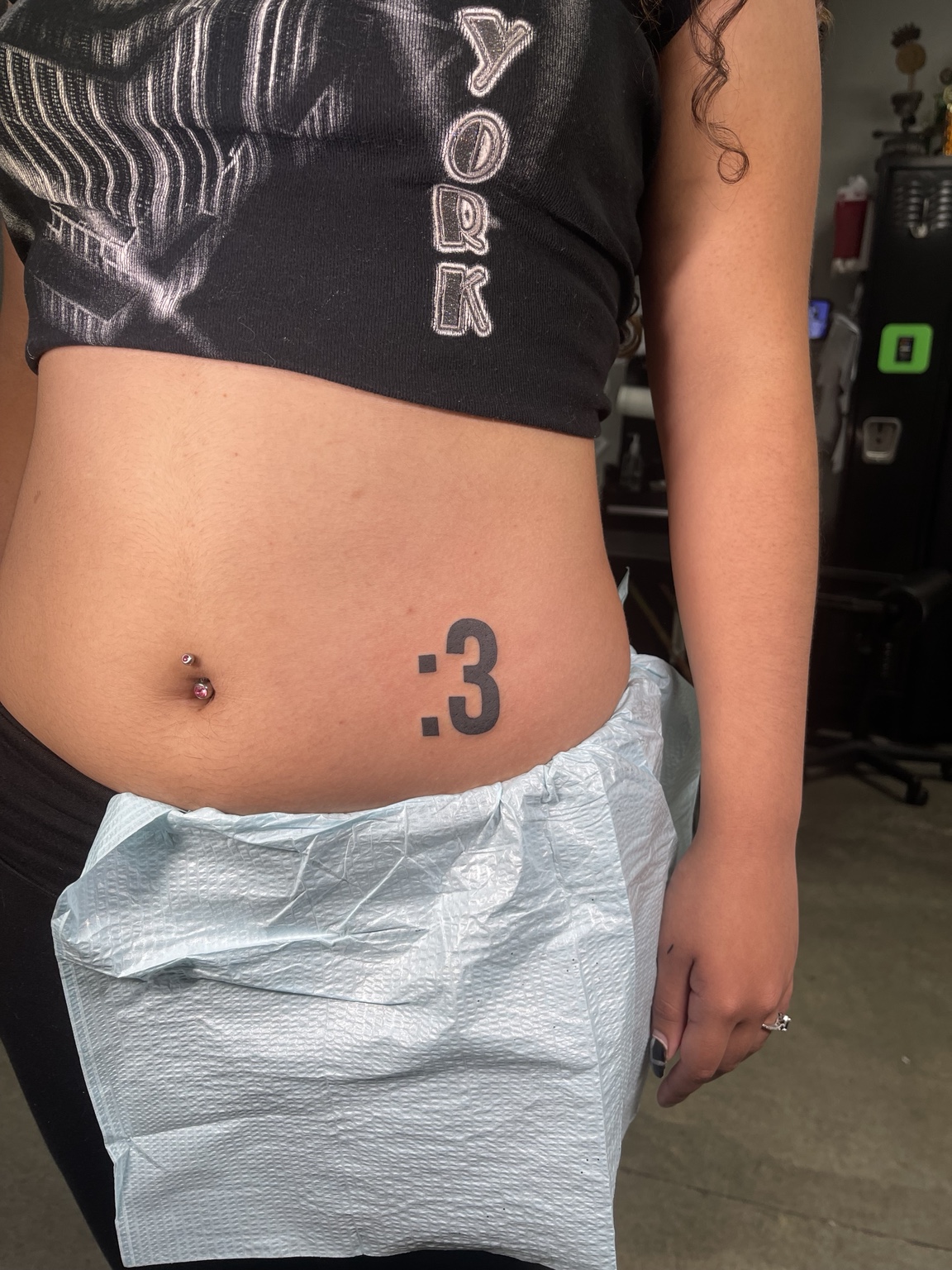 Small smiley tattoo