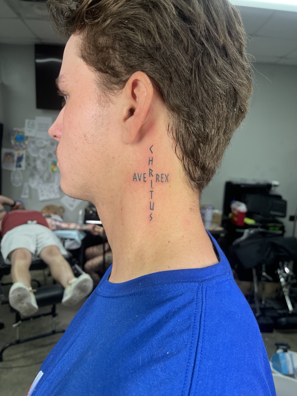 Small neck lettering tattoo