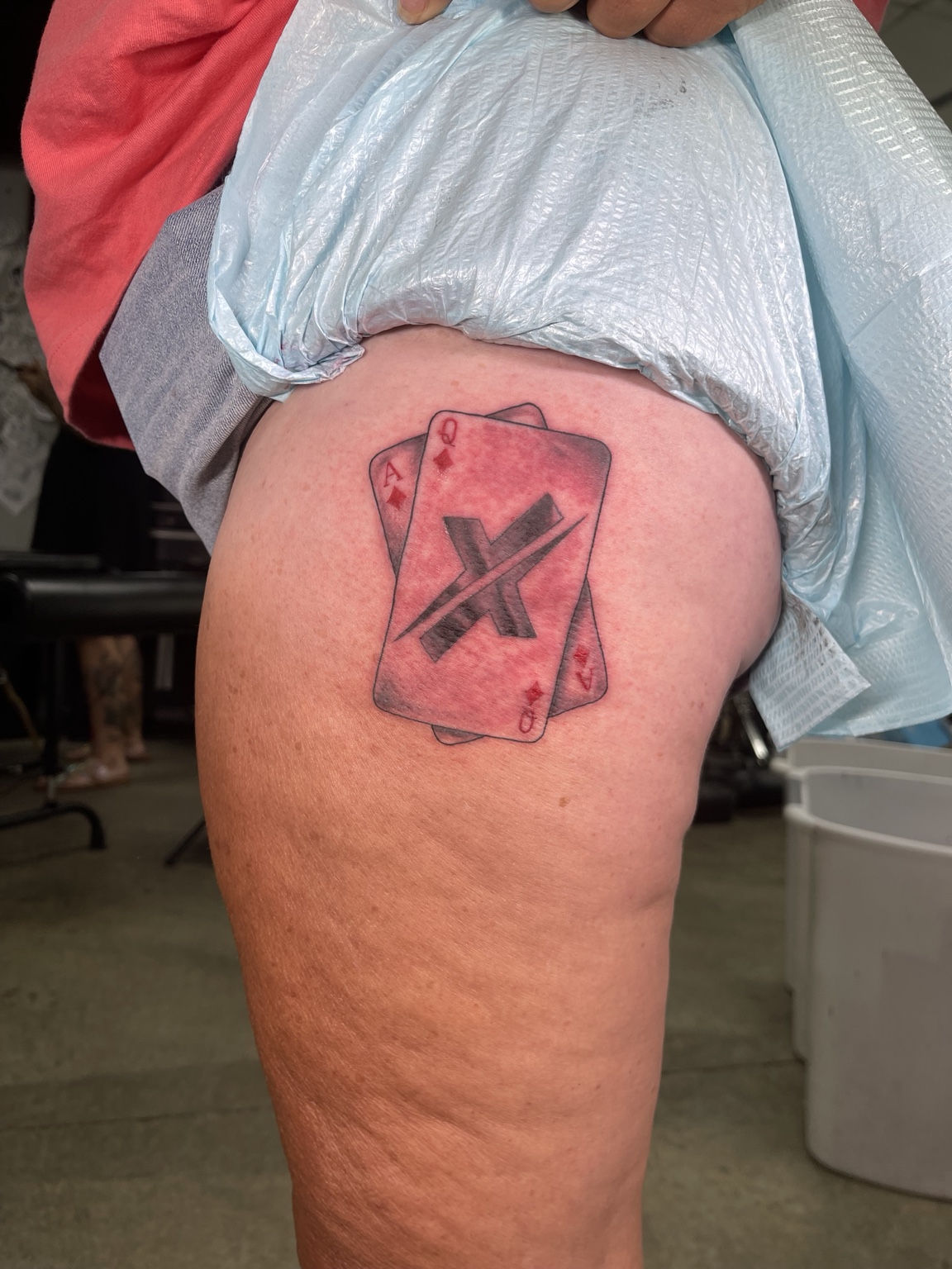 Red graphic upper arm symbol
