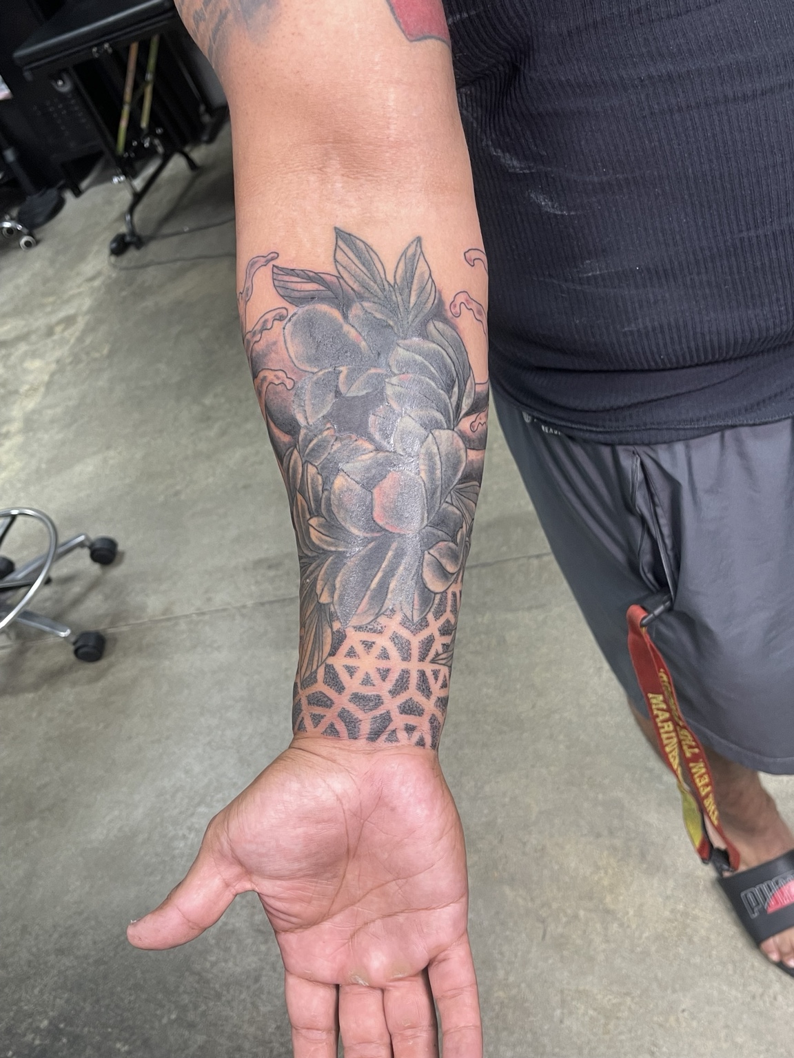 Black and grey peony forearm tattoo primary view