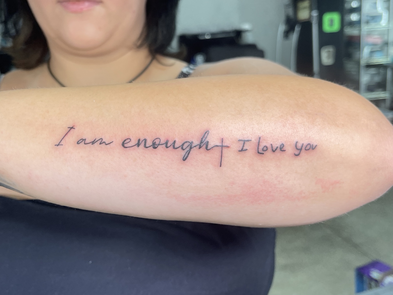Script forearm tattoo