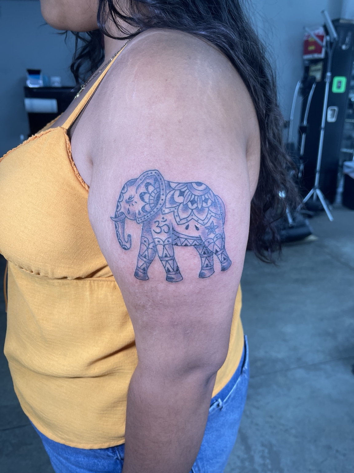 Ornamental elephant upper arm tattoo
