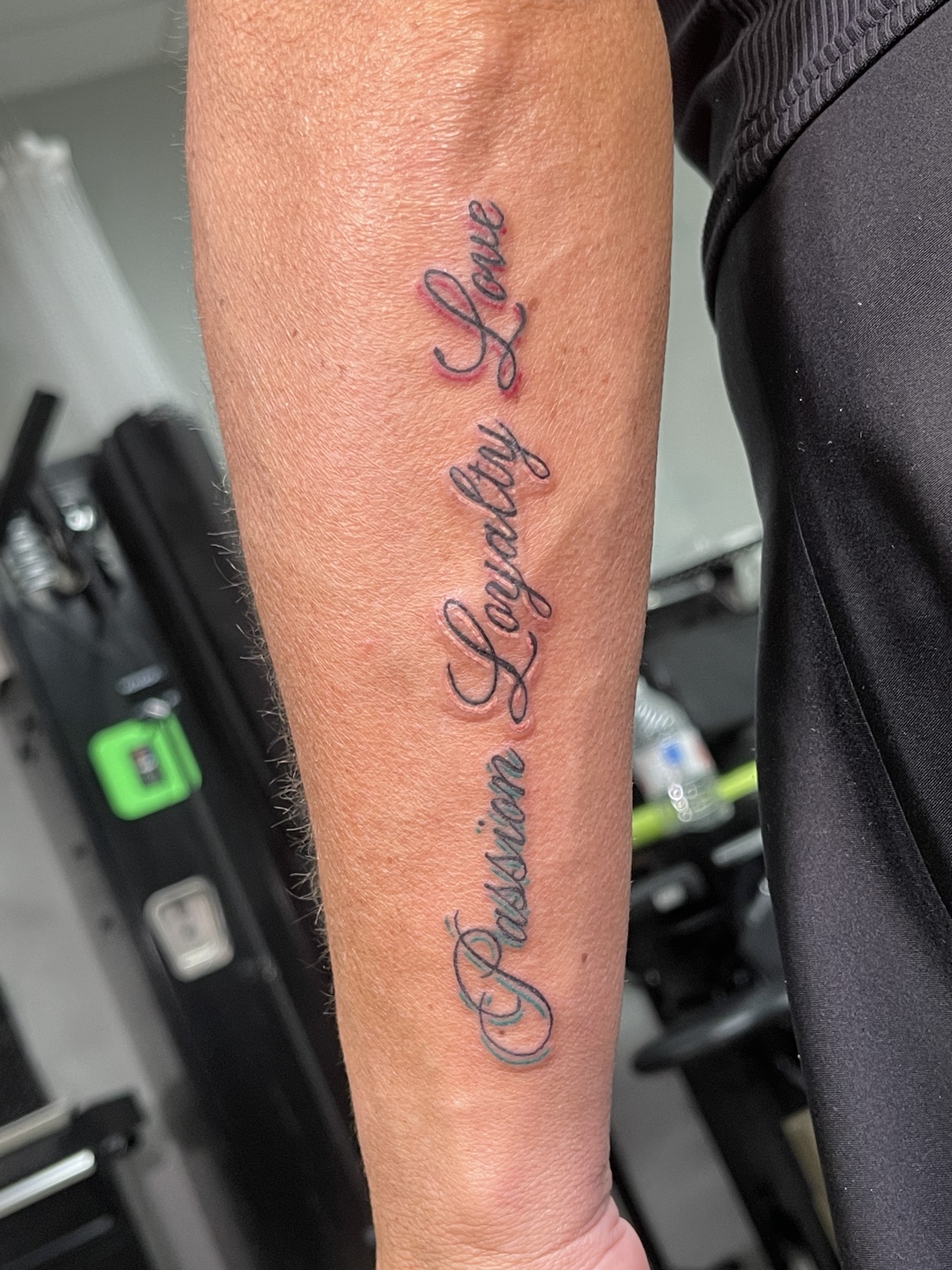 Script forearm tattoo