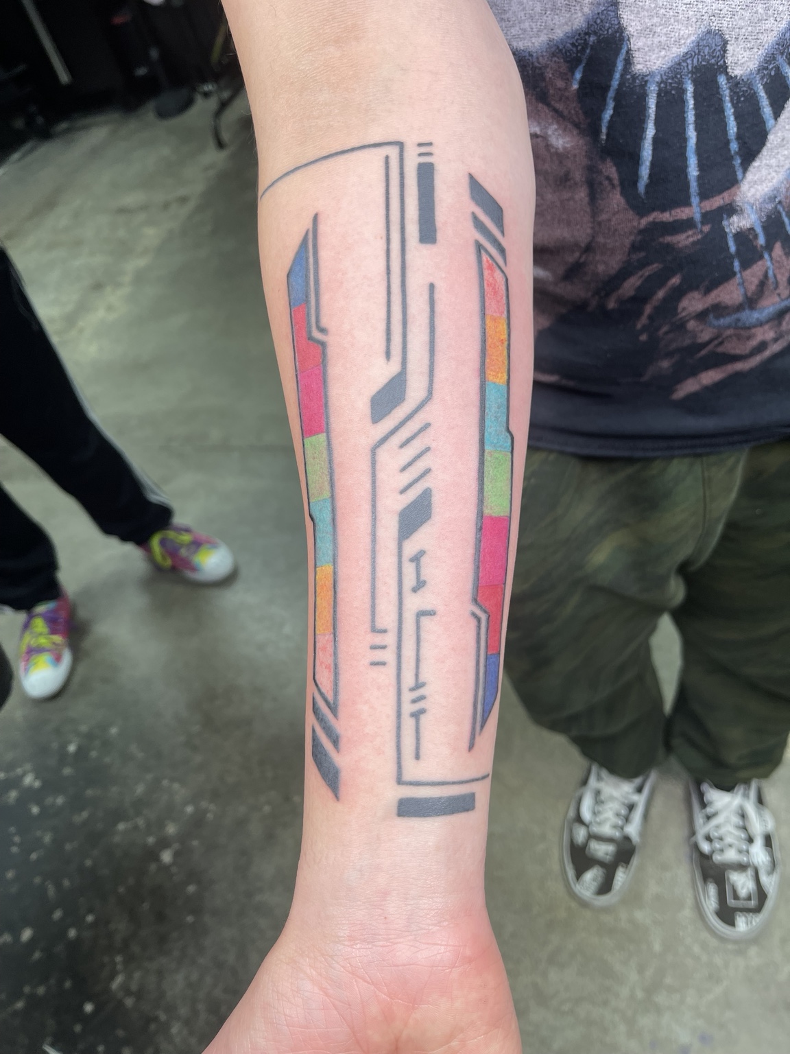 Geometric color forearm tattoo