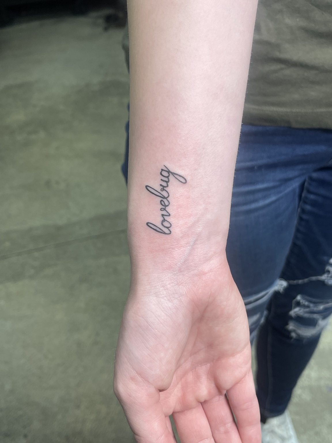 Small wrist script tattoo