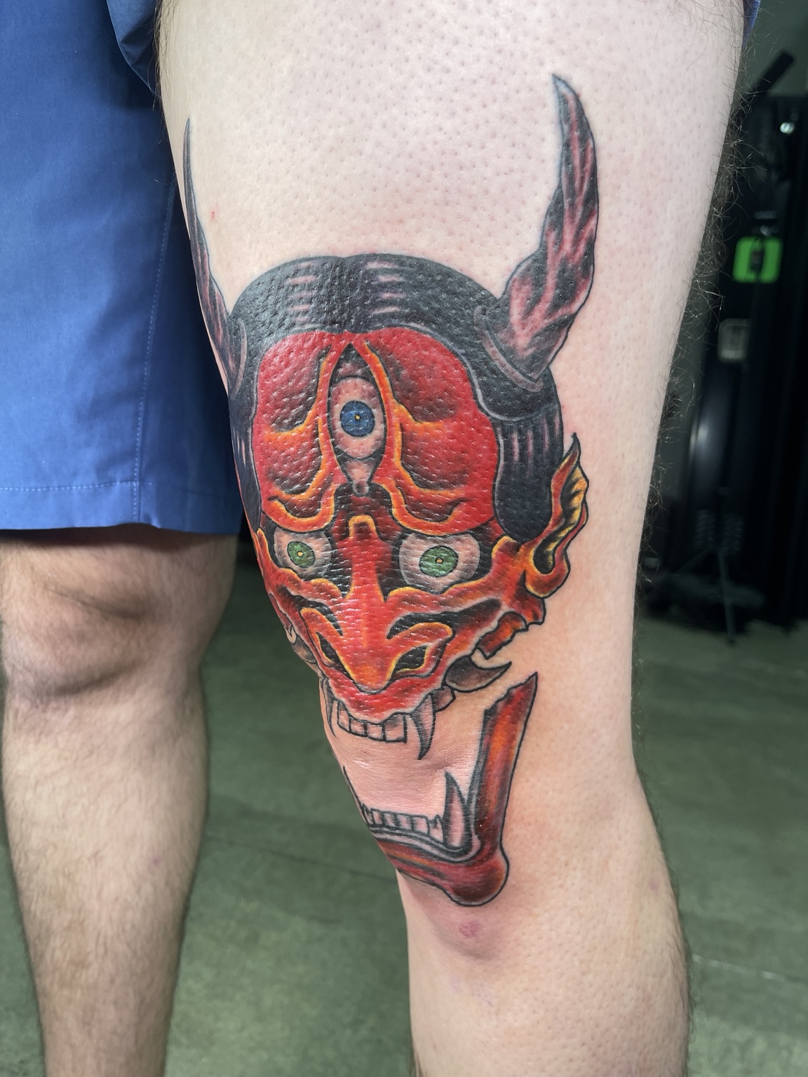 Red oni leg tattoo