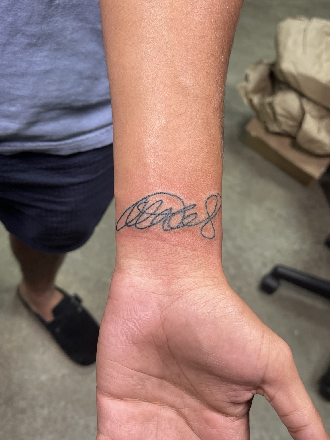 Small wrist script tattoo